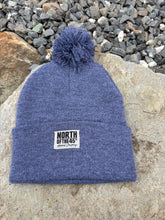 Load image into Gallery viewer, Pom Pom Winter Woven Label Beanie
