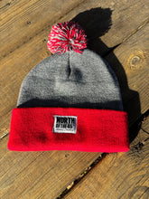 Load image into Gallery viewer, Pom Pom Winter Woven Label Beanie
