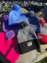 Load image into Gallery viewer, Pom Pom Winter Woven Label Beanie
