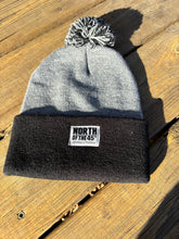 Load image into Gallery viewer, Pom Pom Winter Woven Label Beanie
