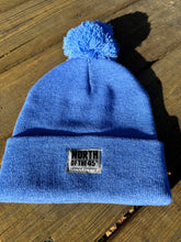 Load image into Gallery viewer, Pom Pom Winter Woven Label Beanie
