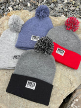 Load image into Gallery viewer, Pom Pom Winter Woven Label Beanie
